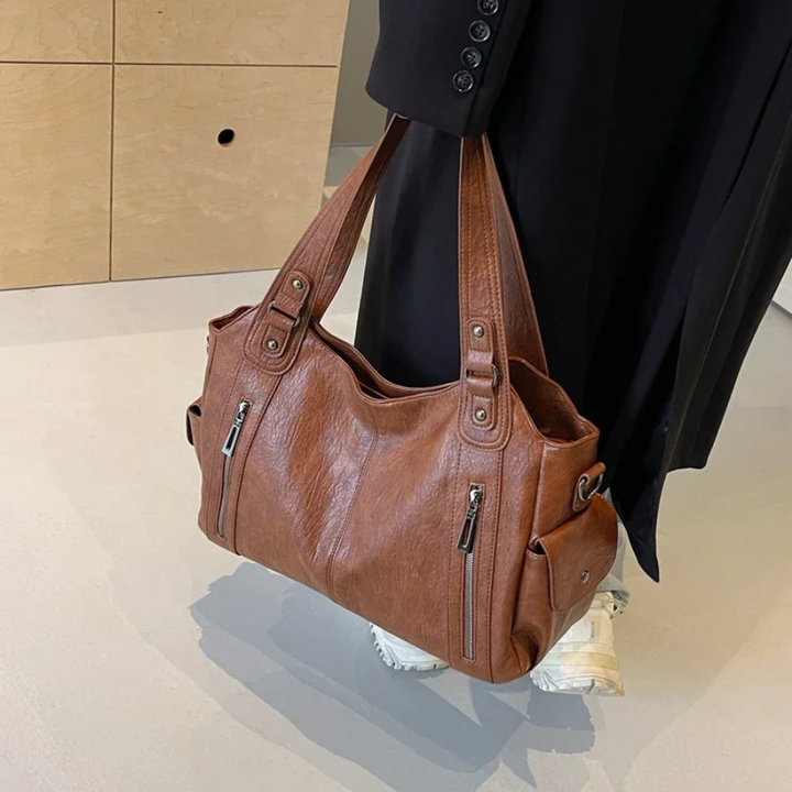 April | Dames schoudertas met ritsvakken handgrepen