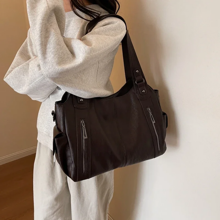 April | Dames schoudertas met ritsvakken handgrepen