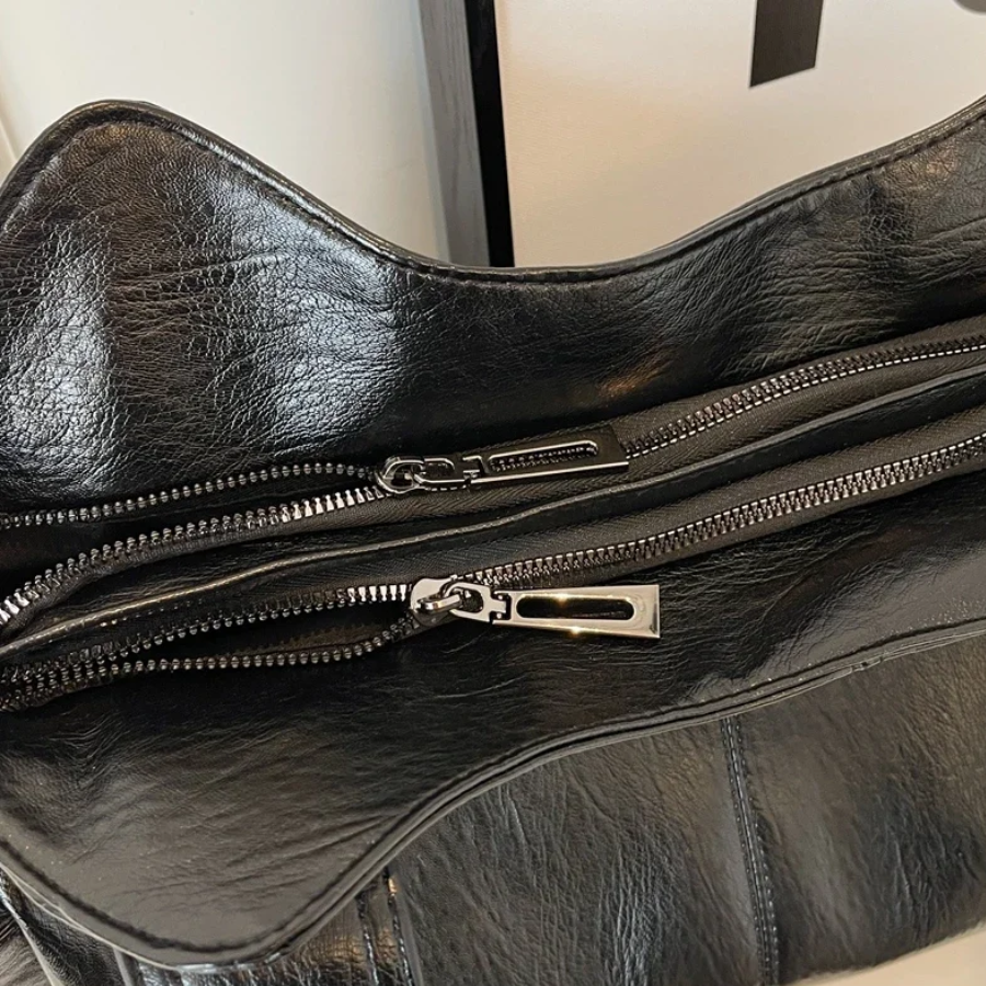 April | Dames schoudertas met ritsvakken handgrepen