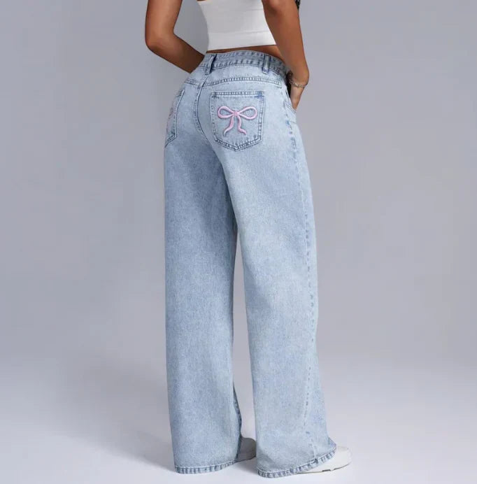 Dahna | Denim Jeans met Wijde Pijpen en Roze Strikdetails