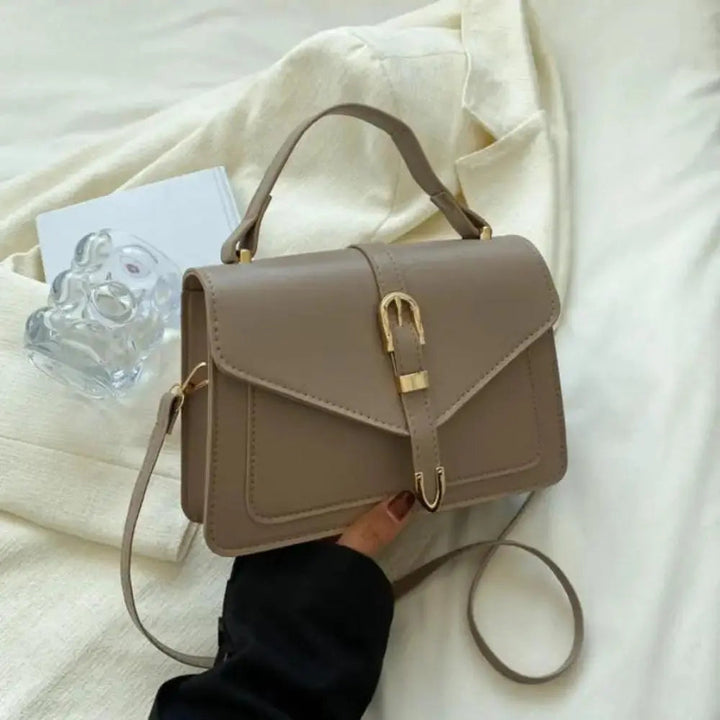 Reagan | Dames crossbody tas met gespsluiting verstelbare schouderband