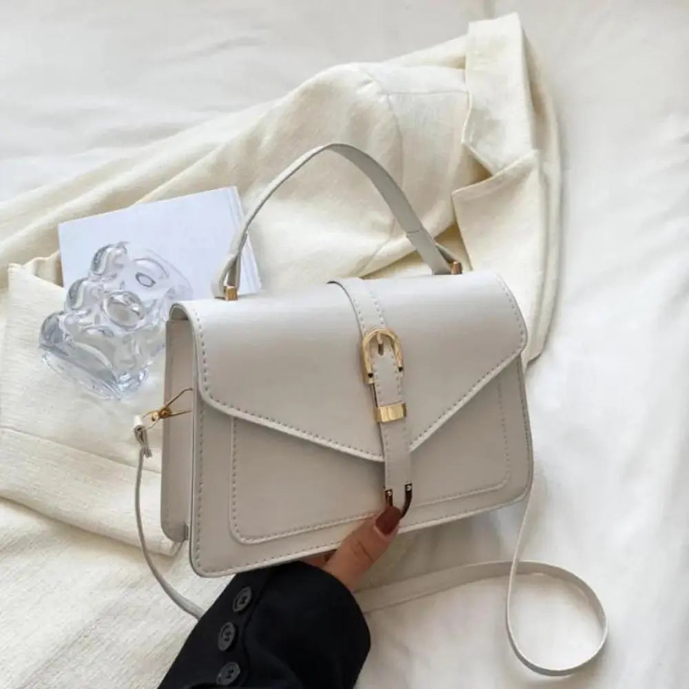 Reagan | Dames crossbody tas met gespsluiting verstelbare schouderband