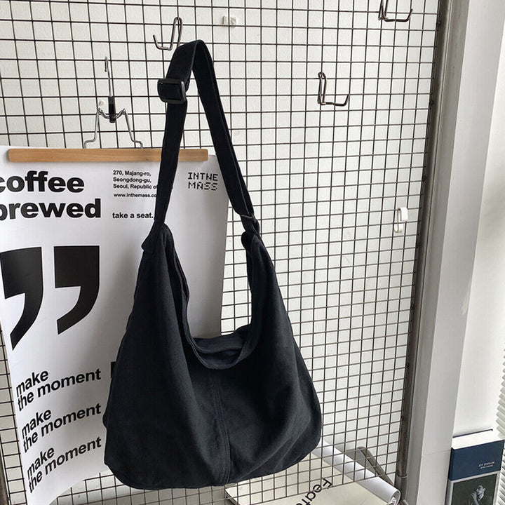 Cassidy | Dames schoudertas met gebogen vorm lange schouderband